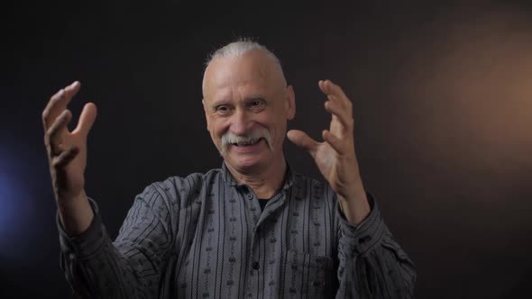 Happy Aged Person Poses Moves and Spins Imaginary Object