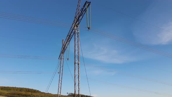 High Voltage Tower with Electric Power Lines Transfening Electrical Energy Through Cable Wires