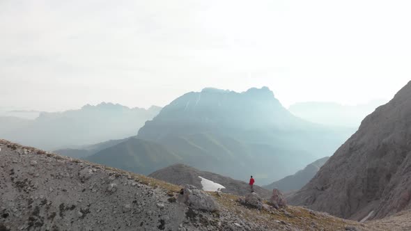 Drone Bypass Man Hiker in Red Jacket Standing in Front of Langkofel Mountain 