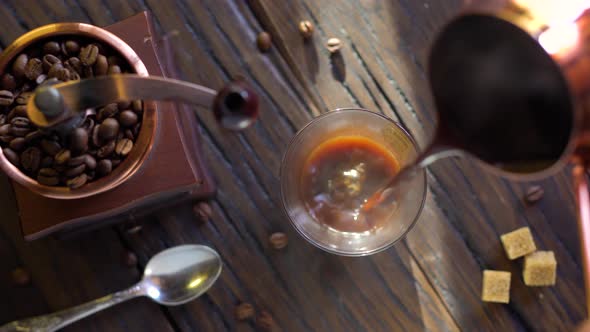 Coffee Cup with Freshly Brewed Coffee on An Old Vintage Table.