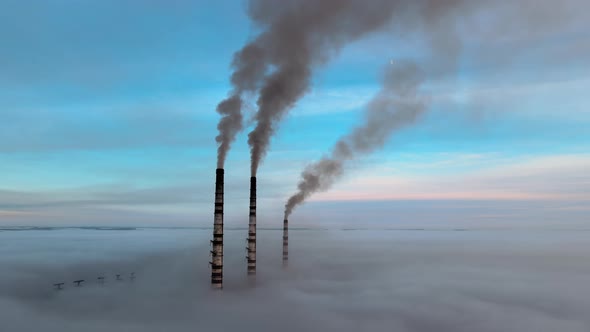 Coal Power Plant High Pipes with Black Smoke Moving Upwards Polluting Atmosphere