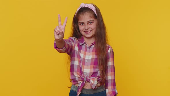 Happy Preteen Child Girl Kid Showing Victory Sign Hoping for Success and Win Doing Peace Gesture