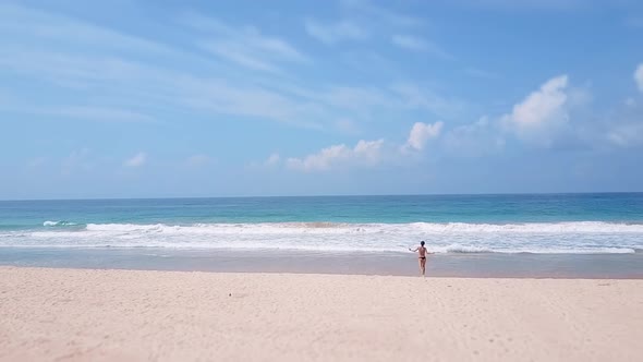 Sporty Asian Woman Running Ocean Beach Bikini