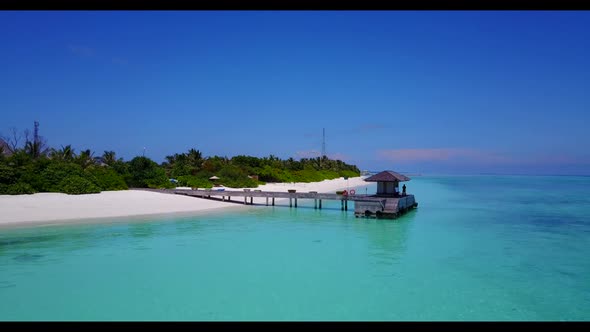 Aerial view panorama of exotic seashore beach journey by blue green lagoon with white sandy backgrou