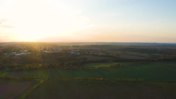 Aerial Drone Shot  a Town in a Rural Area During Golden Sunset