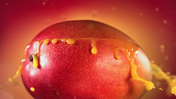 Mango Slice Falling and Splashing on Yellow Pink Background