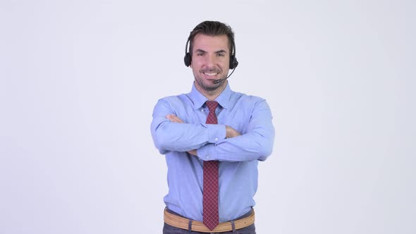 Young Happy Hispanic Businessman As Call Center Representative with Arms Crossed