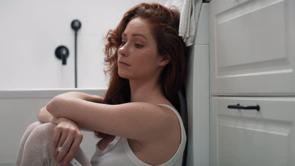 Caucasian woman in bathroom waiting for result of pregnancy test. Shot with RED helium camera in 4K.