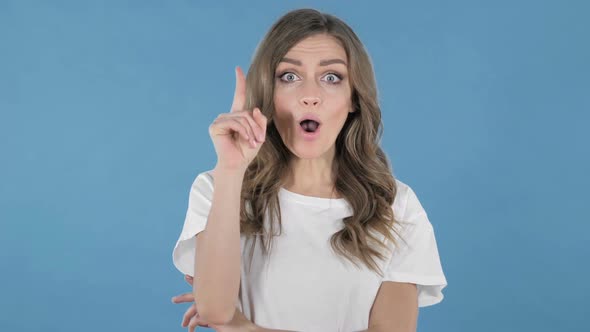 Thinking Young Girl Got New Idea Isolated on Blue Background