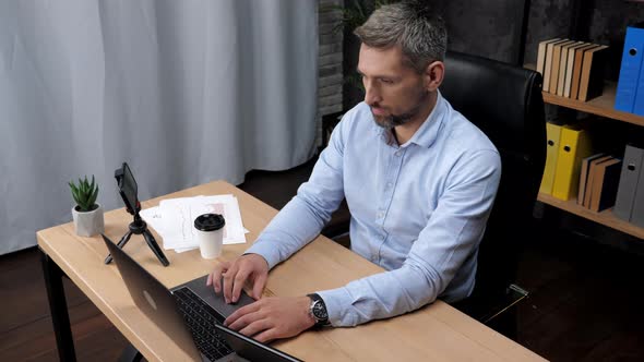 Man Stock Trader Broker Businessman Work for Laptop Typing on Keyboard in Office