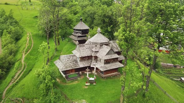 Wooden church in Carpathian, Ukraine. Aerial shot