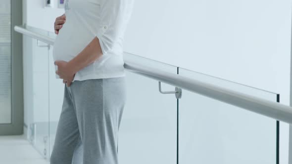 Pregnant woman standing in hospital