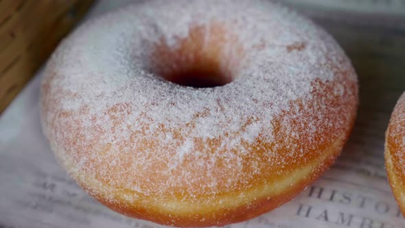 Closeup Freshly Baked Donut with Powdered Sugar