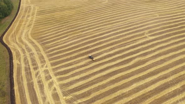 Helicopter View Agricultural Machinery Working in the Field Harvesting