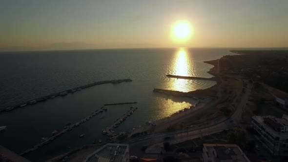 Flying Over the Sea and Quay at Sunrise, Greece