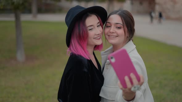 Close Up View on Attractive Young Women Smiling As Taking Selfies Photos with Cell Phone