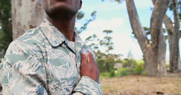 Military soldier looking around in park