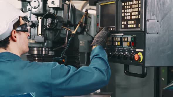 Smart Factory Worker Using Machine in Factory Workshop