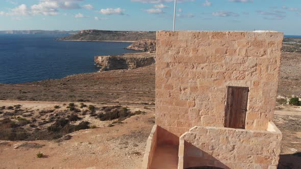 Aerial drone video from northern Malta near the Ghajn Znuber Tower.