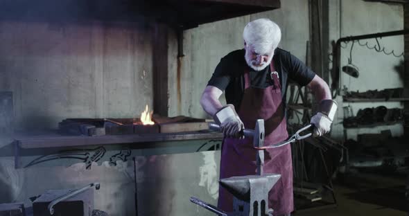 Blacksmith Forging in Big Workshop