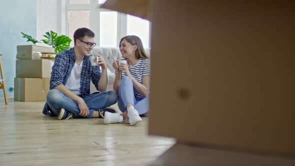 Couple Drinking Coffee in New House