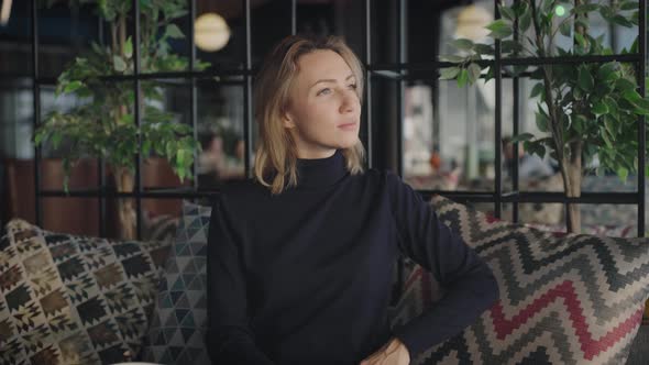 Portrait of an Attractive Woman in a Restaurant