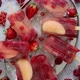 Homemade Raspberry Strawberry Apple and Currant Popsicles on Metal Plate with Ice Assorted Berries - VideoHive Item for Sale