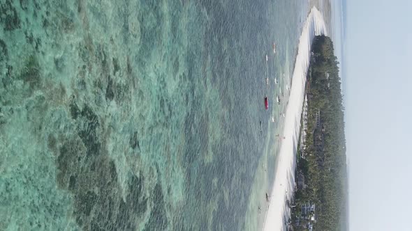 Vertical Video of the Ocean Near the Coast of Zanzibar Tanzania Aerial View