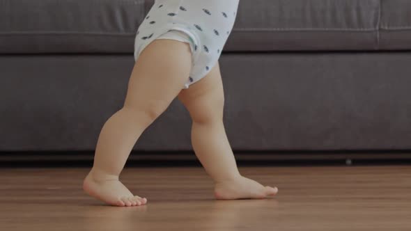 Cute Baby Boy Learning To Walk And Make His First Steps