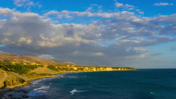 Time Lapse landscape coast at Sunset. Clouds moving over Mountain and Sea