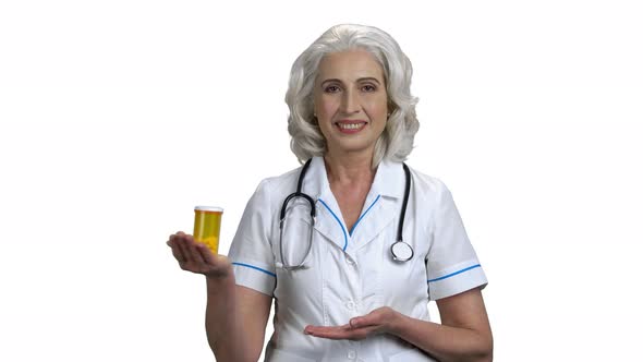 Caucasian Female Doctor Showing Bottle of Pills