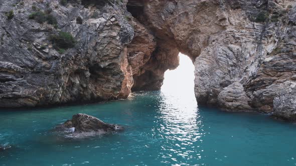 Aerial 4k left to right panning motion view of the rock formations of Archway Islands