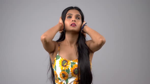 Unhappy Indian girl closses her ears