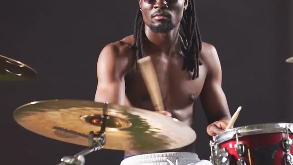 Good-looking Artistic African Black Male Drummer Enjoying Playing Drums