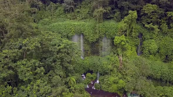 Amazon green rainforest and Waterfall.Unbelievable aerial view flight pull fly in drone footage of