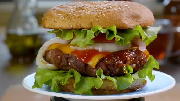 Beef Burger Rotating on the Kitchen Table