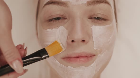 Woman Receiving Beauty Procedures in Spa Center