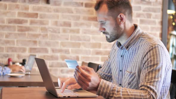 Upset Young Man after Online Shopping Failure