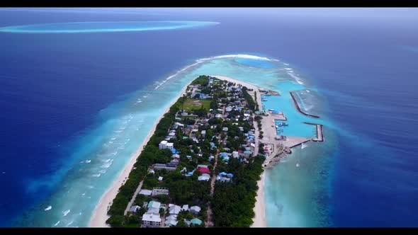 Aerial top view scenery of tropical tourist beach holiday by clear ocean with white sandy background