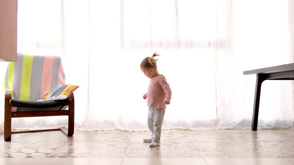 Child Spinning in Dance at Home