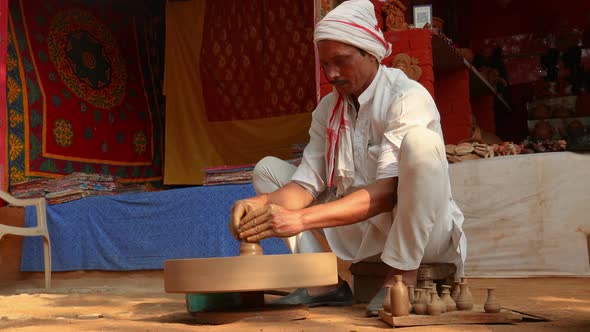 Potter at Work Makes Ceramic Dishes