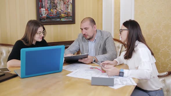 Business Team with Scheme Meeting and Discussing Problem at Office