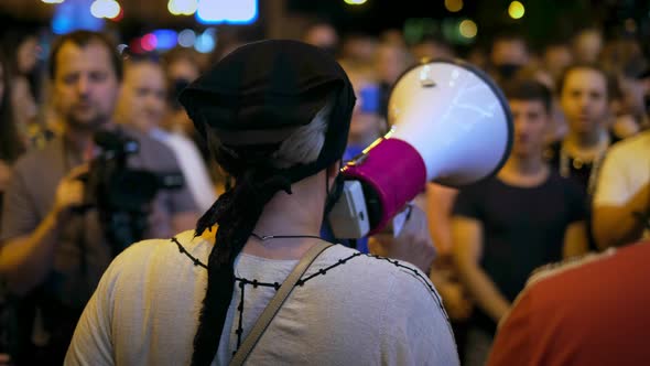 Public Feministic Speaking with Bullhorn Megaphone