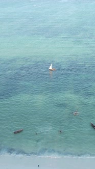 Vertical Video Boats in the Ocean Near the Coast of Zanzibar Tanzania