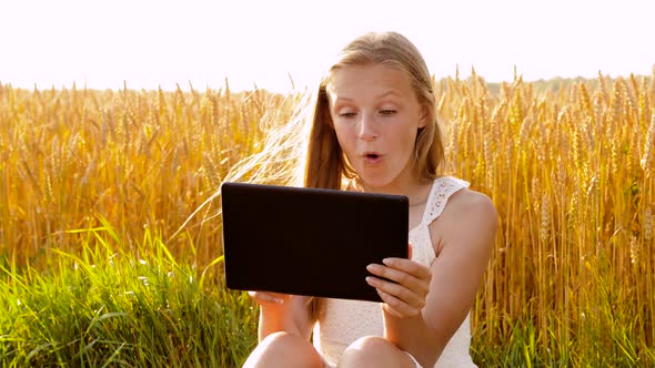 Smiling with Tablet Computer on Cereal Field