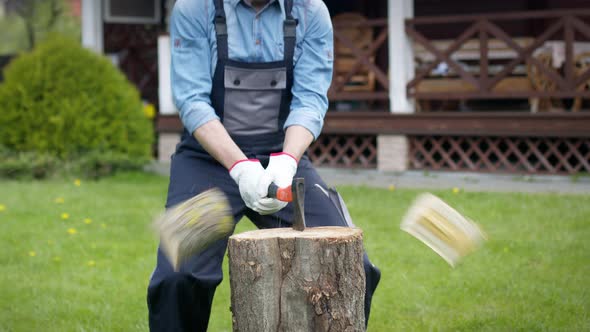 Lumberjack Chopping Wood for Winter with an Axe