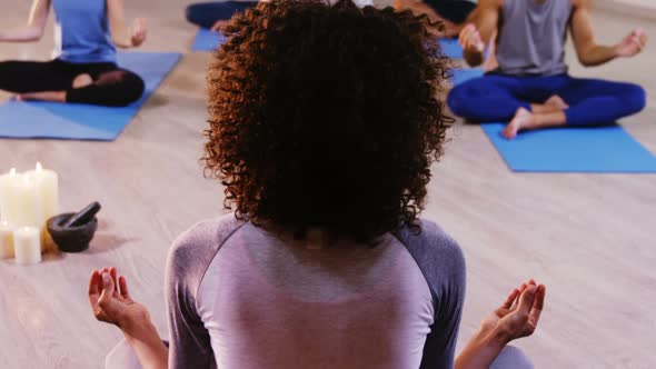 Instructor taking yoga class