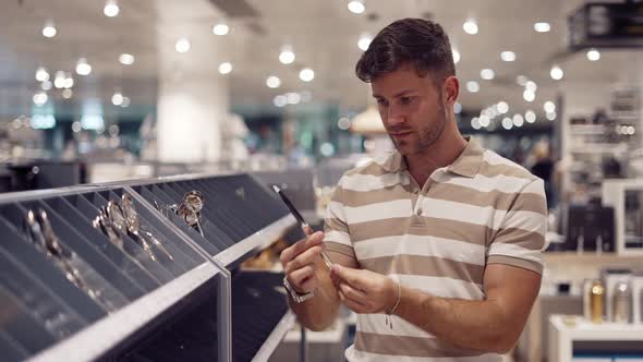 Male Buyer Choosing Silverware in Store