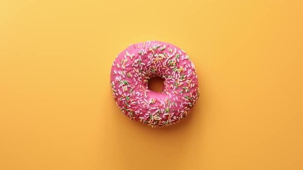 Rotating Doughnut Covered Frosted Glaze Pink Chocolate Isolated