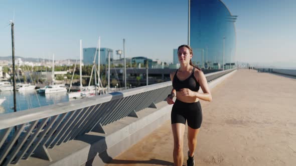 Female Runner Checking Smart Watch